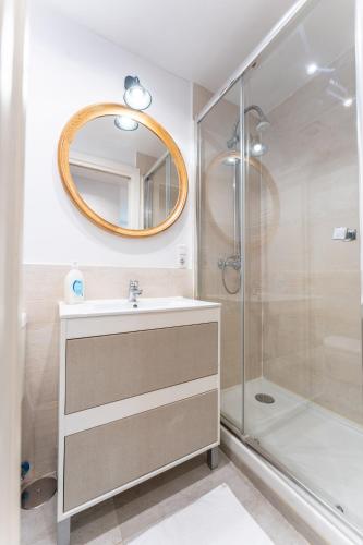 a bathroom with a sink and a shower at Warm and Inviting, Central location by urbanhosting in Santander