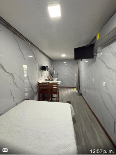 a room with a bed and a table in it at Apartamento doña Lety in Fortuna