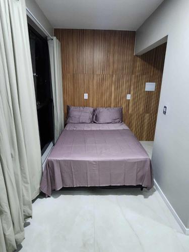 Ένα ή περισσότερα κρεβάτια σε δωμάτιο στο Apartamento-5 pé na areia proximo a lagoa e rio