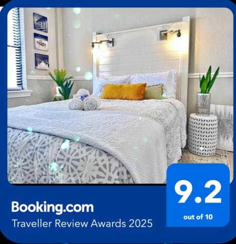 a bedroom with a bed with a white bedspread at Charming Jax Apt for 4 with free parking in Jacksonville