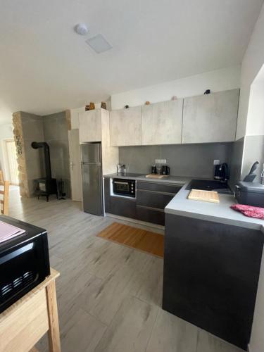 a kitchen with stainless steel appliances in a room at Apartmány Ořechovka Wellness in Turnov