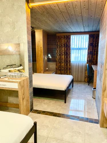 Letto o letti in una camera di M-ODA OTEL