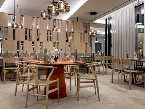 a dining room with a table and chairs at Aparthotel Tante Trude in Oetz