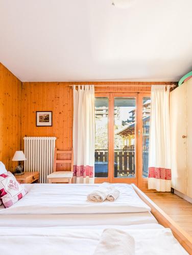 Postel nebo postele na pokoji v ubytování Center of Nendaz ! Apartment 3 rooms with balcony