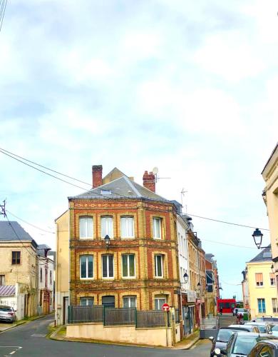 a large brick building on the side of a street at MAISON DE PECHEUR Vue Port - Commerces aux pieds - 1 à 5 Pers in Fécamp
