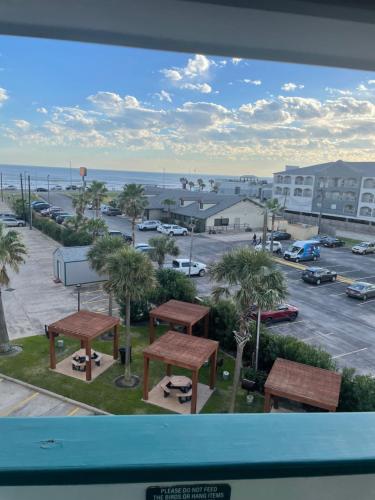a view from a window of a parking lot at Casa Del Mar Galveston in Galveston