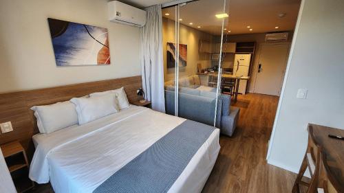 Ένα ή περισσότερα κρεβάτια σε δωμάτιο στο Aconchegante Flat Serra Class