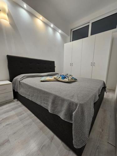 a bedroom with a bed with a blanket on it at Bella Vernazza with AC and Balcony in Vernazza