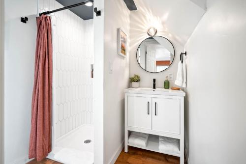 a bathroom with a sink and a mirror at Laid Back Cabin 7 Mn To Glacier, Private Fire Pit in Coram