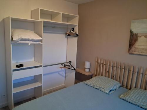 Ένα ή περισσότερα κρεβάτια σε δωμάτιο στο Appartement 1 chambre face aux dunes