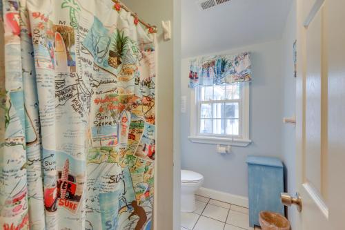 a bathroom with a toilet and a shower curtain at Less Than half Mi to Beach Wildwood Getaway with Patio! in Wildwood