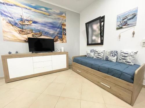 Televízia a/alebo spoločenská miestnosť v ubytovaní Domus Rosaliae - Casa Vacanze