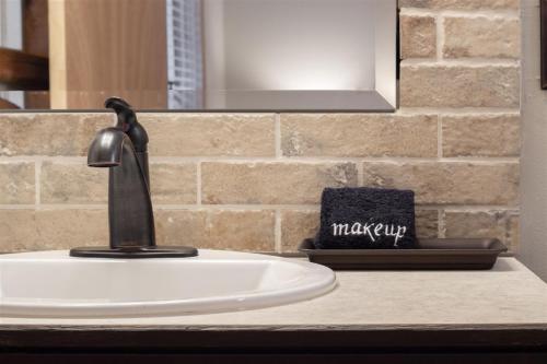a bathroom sink with a faucet on a counter at Gnomerson’s Hideaway in Packwood