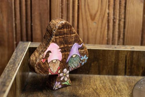 a figurine of a cat is sitting on a table at Gnomerson’s Hideaway in Packwood