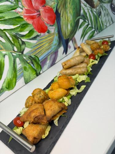 a tray of food sitting on top of a table at Reve D Amazonie & Spa in Les Mages