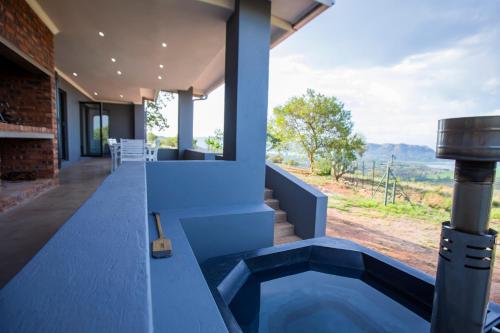 an outdoor plunge pool in a house with a view at Sink Huis at Benlize in Pelindaba
