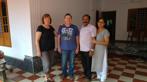 a group of people standing in a room at Grace Guest Home in Trichūr