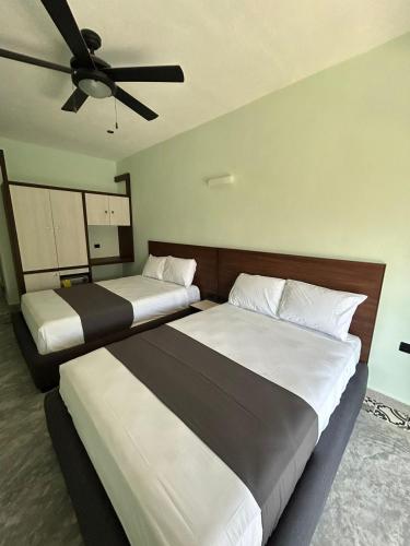 Postel nebo postele na pokoji v ubytování Hotel Mariel Holbox