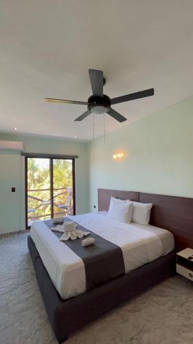 Postel nebo postele na pokoji v ubytování Hotel Mariel Holbox