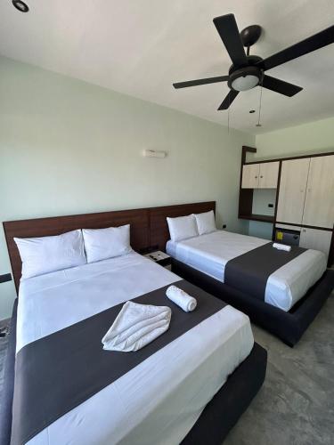 Postel nebo postele na pokoji v ubytování Hotel Mariel Holbox