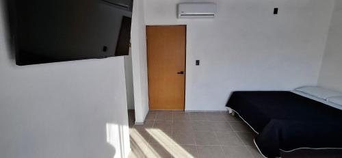 TV a/nebo společenská místnost v ubytování Hotel Caminos