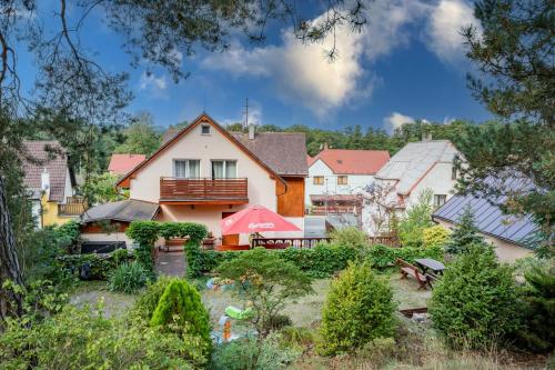 a view of a house from the garden at Penzion Zuzana in Staré Splavy