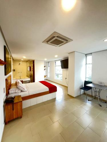 Postel nebo postele na pokoji v ubytování Hotel Portal Central