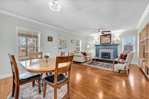a dining room with a table and a fireplace at University Place, family stay, practically on JBU campus in Siloam Springs