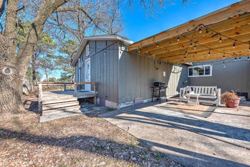 a patio with a bench and a building at University Place, family stay, practically on JBU campus in Siloam Springs