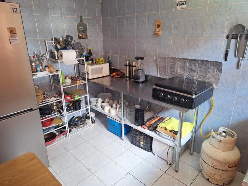 Η κουζίνα ή μικρή κουζίνα στο Hostal Habitación Mintaka