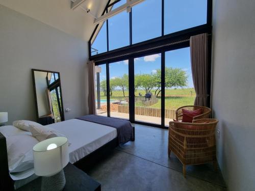 Ένα ή περισσότερα κρεβάτια σε δωμάτιο στο Lindi Lodge, Mjejane Game Reserve