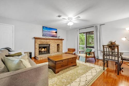 a living room with a couch and a fireplace at A Touch of Serenity in Tallahassee