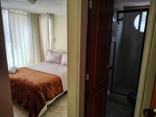 Ένα ή περισσότερα κρεβάτια σε δωμάτιο στο Balcones del Chicamocha