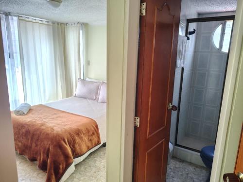 Ένα ή περισσότερα κρεβάτια σε δωμάτιο στο Balcones del Chicamocha