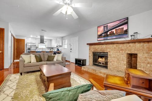a living room with a couch and a fireplace at A Touch of Serenity in Tallahassee