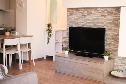 a living room with a large flat screen tv at Casa Carlo in Chieti