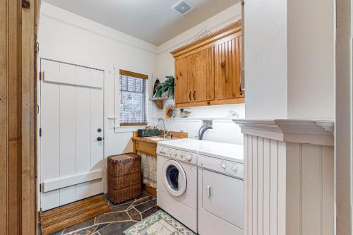a kitchen with a washing machine and a sink at Lakefront Luxury in Tahoe City
