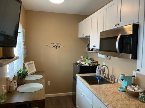 a kitchen with a sink and a stove top oven at Country Studio Unit A 20 min SMF & UCDavis Campus in Woodland