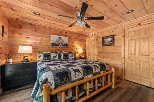 a bedroom with a bed and a ceiling fan at Heavenly Bliss By Ghosal Luxury Lodging in Sevierville