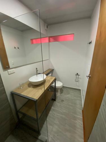 a bathroom with a sink and a toilet at Apartaestudio comodo y central S3 - WiFi in Pasto