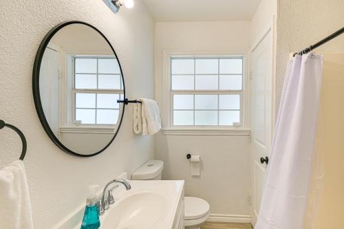 a bathroom with a sink and a mirror at Walk to Cowboys Games Arlington Home with Pool! in Arlington