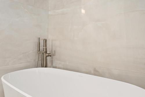 a bathroom with a white toilet in a room at Relax & Renew - SONG8 in Solana Beach