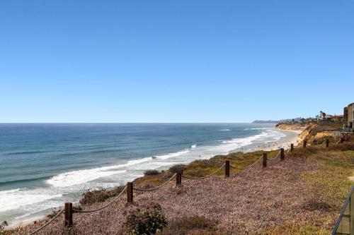 a view of the beach with a rope fence at Relax & Renew - SONG8 in Solana Beach