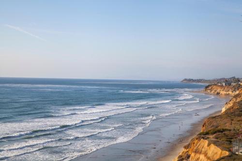 a view of a beach with people walking on it at Don't Worry Beach Happy SONG13 in Solana Beach