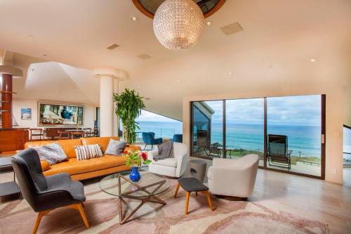 a living room with a couch and chairs at Enchanting Oasis - SONG72 in Solana Beach