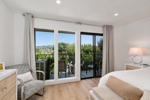 a bedroom with a bed and a sliding glass door at Fairway Haven - CB2507 in Carlsbad