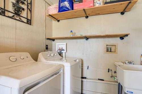 a laundry room with a washer and dryer at 4 Mi to Historic Dtwn Venice Home with Heated Pool! in Venice