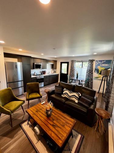 a living room with a couch and a table at Brand New Loft in the Heart of Downtown Bozeman in Bozeman