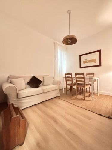 a living room with a couch and a table at Casa D'Avó Bá in Évora