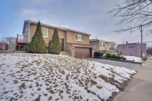a house with snow on the ground in front of it at 2 Mi to Dtwn St Paul Home with Private Deck and Yard! in Saint Paul
